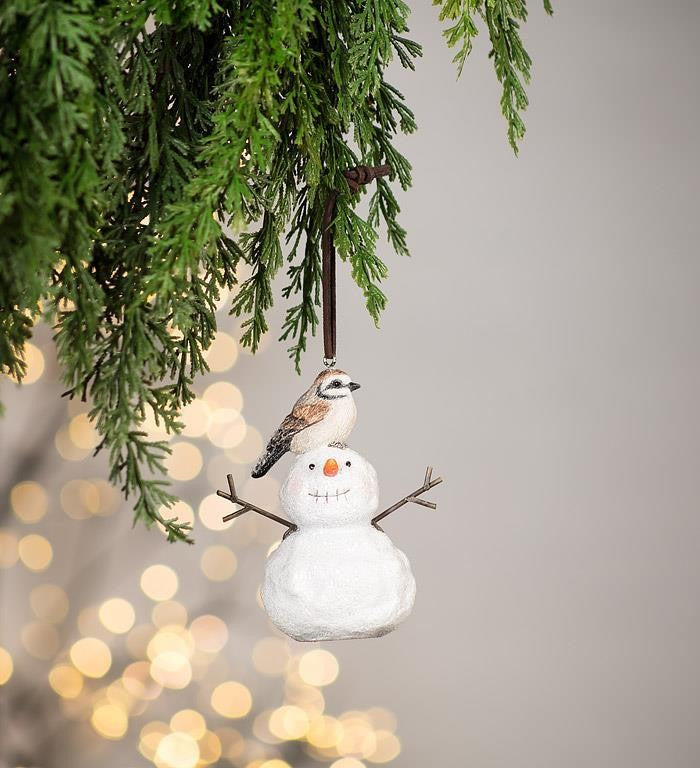 Bird Sitting on Snowman Ornament