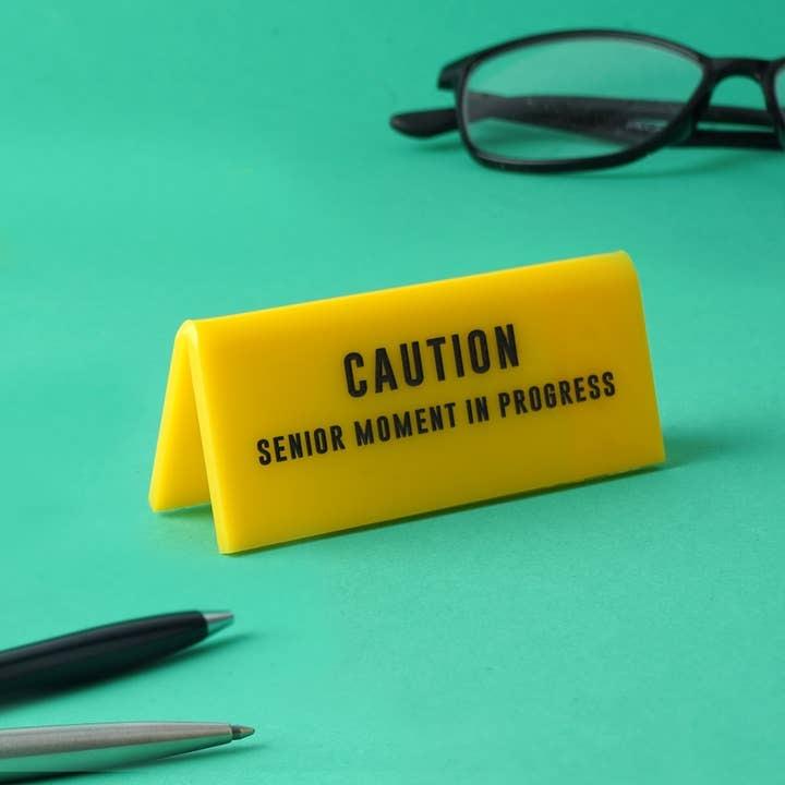 'Senior Moment In Progress' Yellow Desk Sign