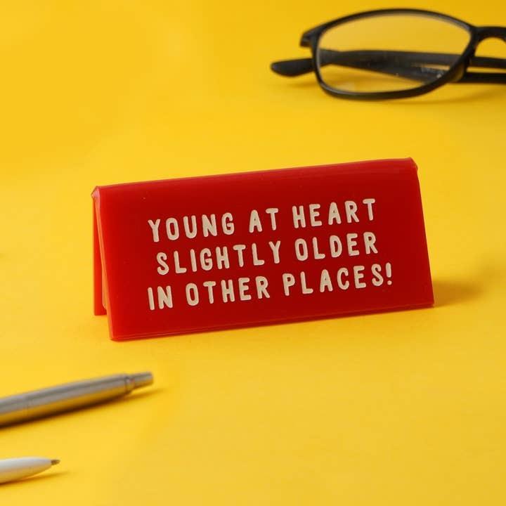 'Young At Heart' Red Desk Sign